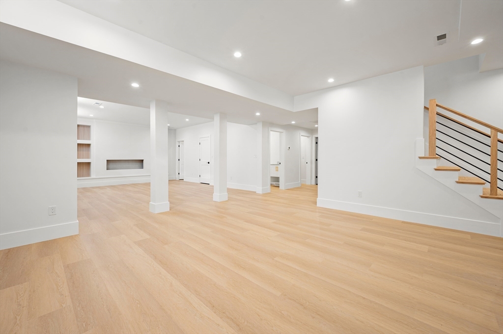 345 Central Avenue Needham, MA 02494 - Photo 29 of 33 a view of an empty room with wooden floor