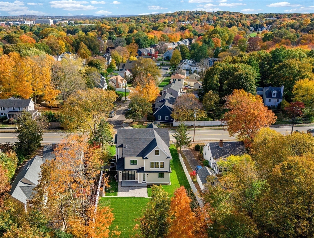 345 Central Avenue Needham, MA 02494 - Photo 32 of 33 an aerial view of residential houses with outdoor space and trees