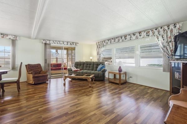 101 Mango Cove Leesburg, FL 34748 - Photo 11 of 28 a living room with furniture and a wooden floor