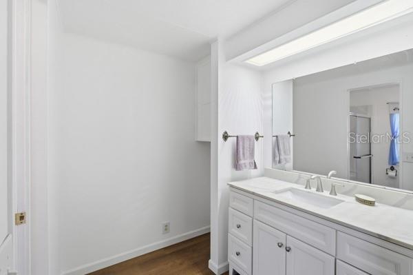 101 Mango Cove Leesburg, FL 34748 - Photo 19 of 28 a bathroom with a granite countertop sink and a mirror