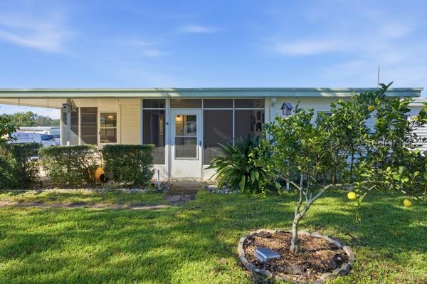 101 Mango Cove Leesburg, FL 34748 - Photo 20 of 28 a front view of a house with a yard
