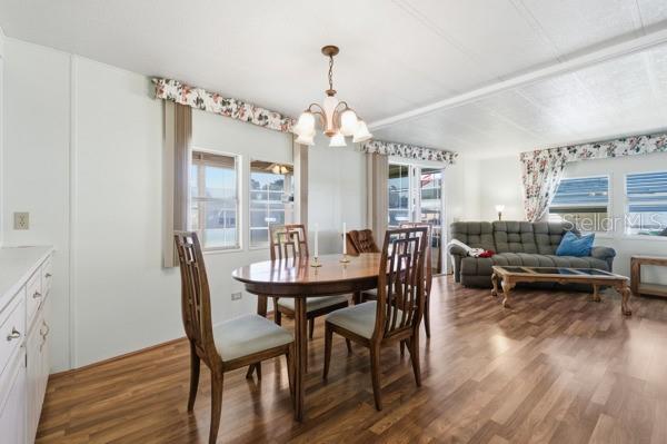 101 Mango Cove Leesburg, FL 34748 - Photo 5 of 28 a view of a dining room with furniture window and wooden floor
