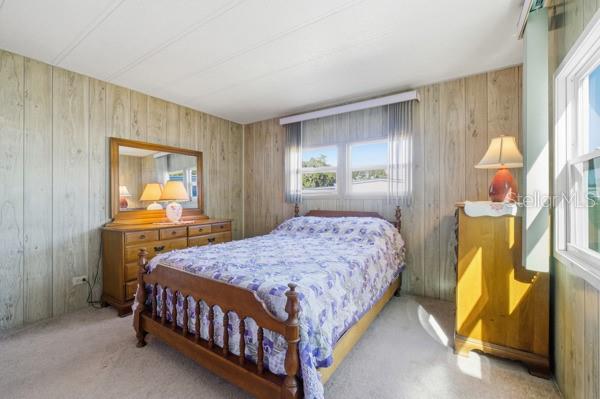 101 Mango Cove Leesburg, FL 34748 - Photo 10 of 28 a bedroom with a bed and a window