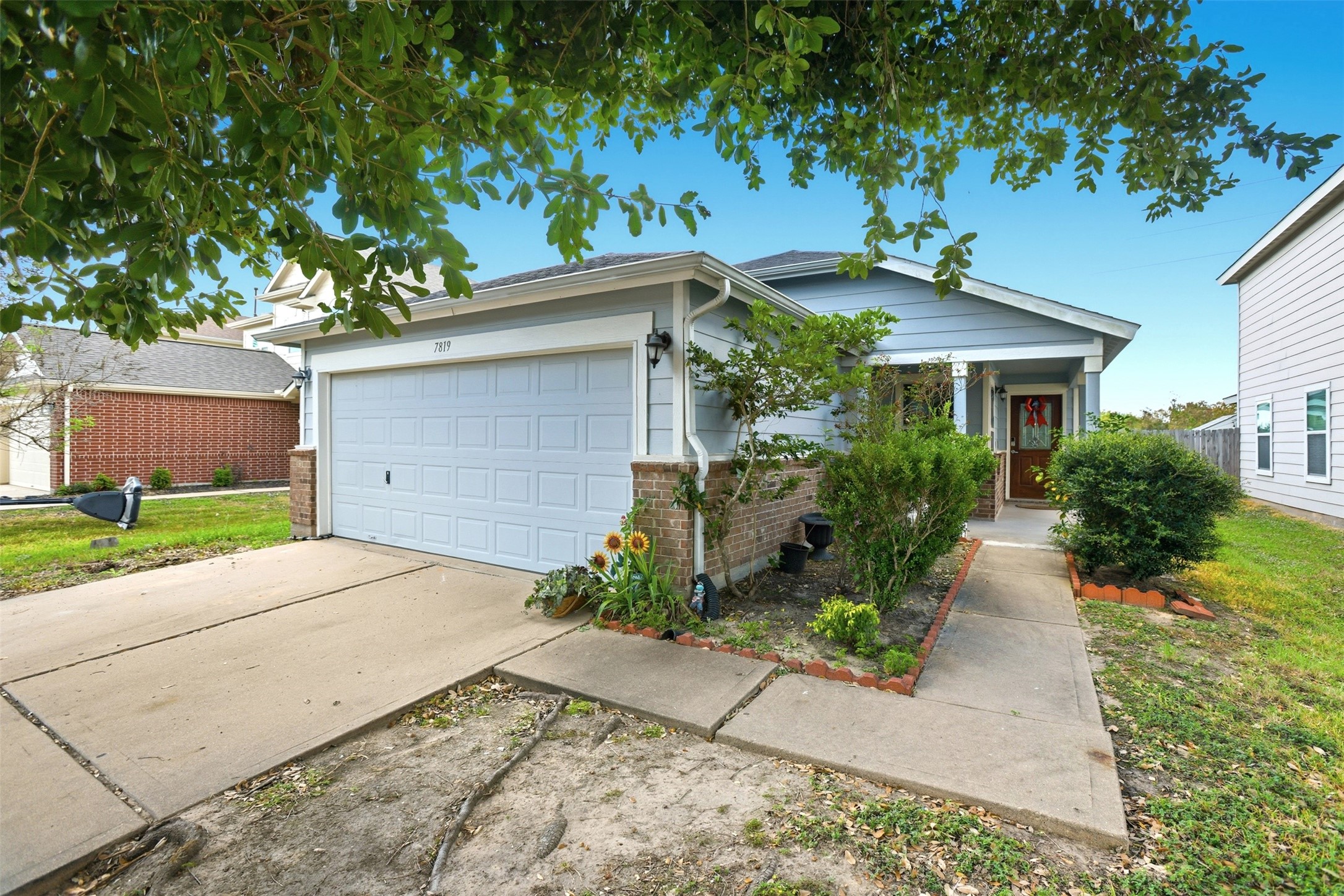 7819 Pasture Spring Lane Cypress, TX 77433 - Photo 2 of 22 front view of a house with a yard
