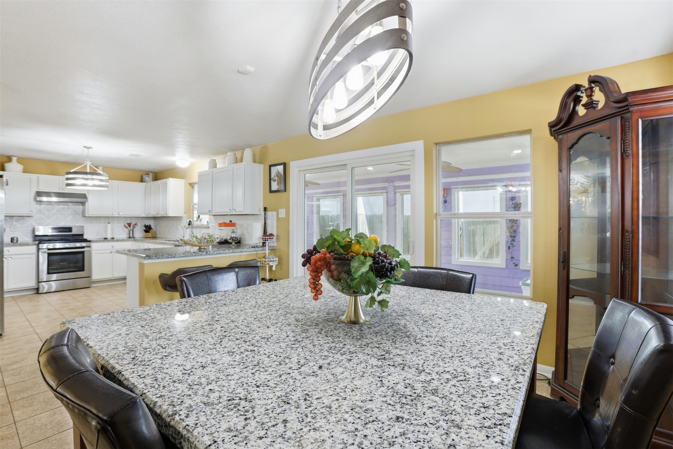 7819 Pasture Spring Lane Cypress, TX 77433 - Photo 7 of 22 a kitchen with stainless steel appliances granite countertop sink stove and refrigerator