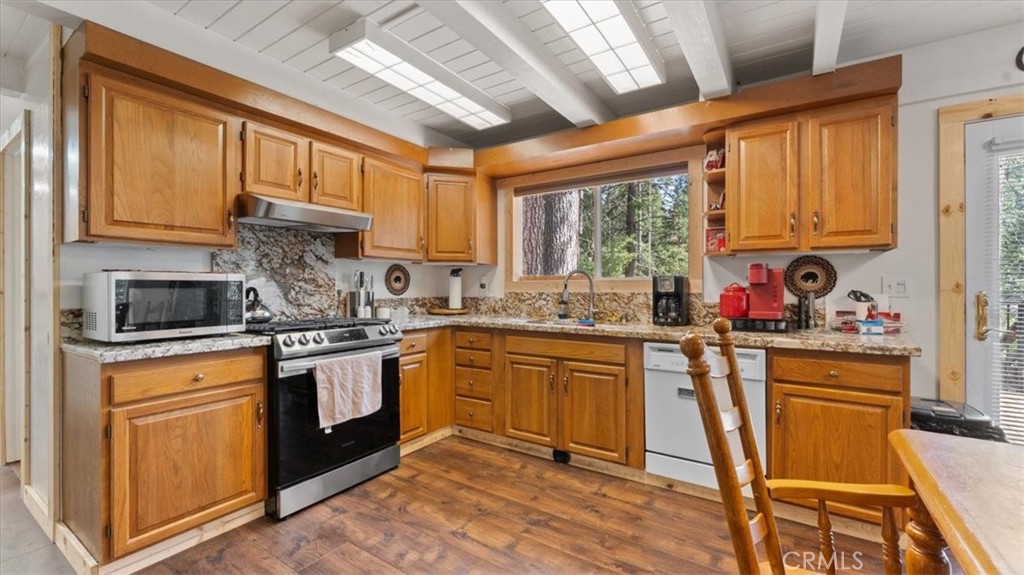 6231 Merry Way Clipper Mills, CA 95930 - Photo 12 of 60 a kitchen with stainless steel appliances granite countertop a stove a sink dishwasher a refrigerator and cabinets with wooden floor