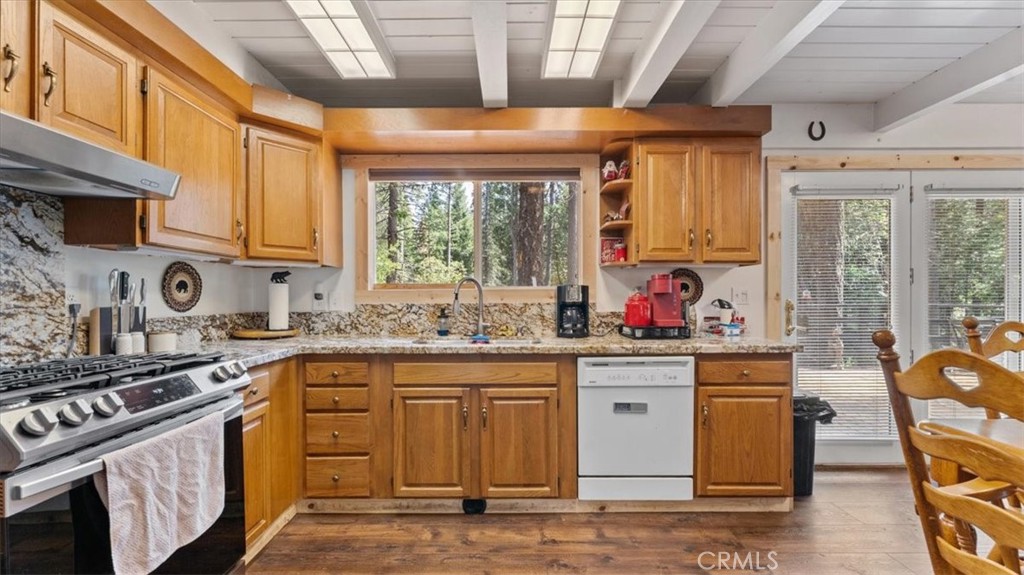 6231 Merry Way Clipper Mills, CA 95930 - Photo 13 of 60 a kitchen with stainless steel appliances granite countertop a stove a sink dishwasher and cabinets with wooden floor