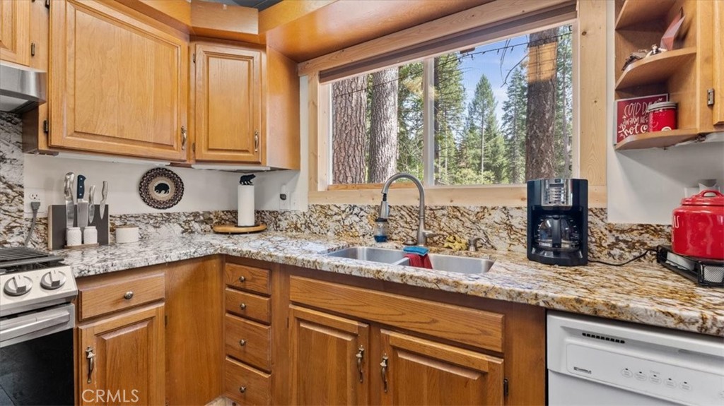 6231 Merry Way Clipper Mills, CA 95930 - Photo 14 of 60 a kitchen with granite countertop a sink and a window