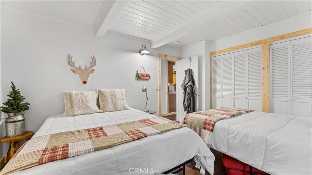 6231 Merry Way Clipper Mills, CA 95930 - Photo 27 of 60 a bedroom with a large bed and a potted plant