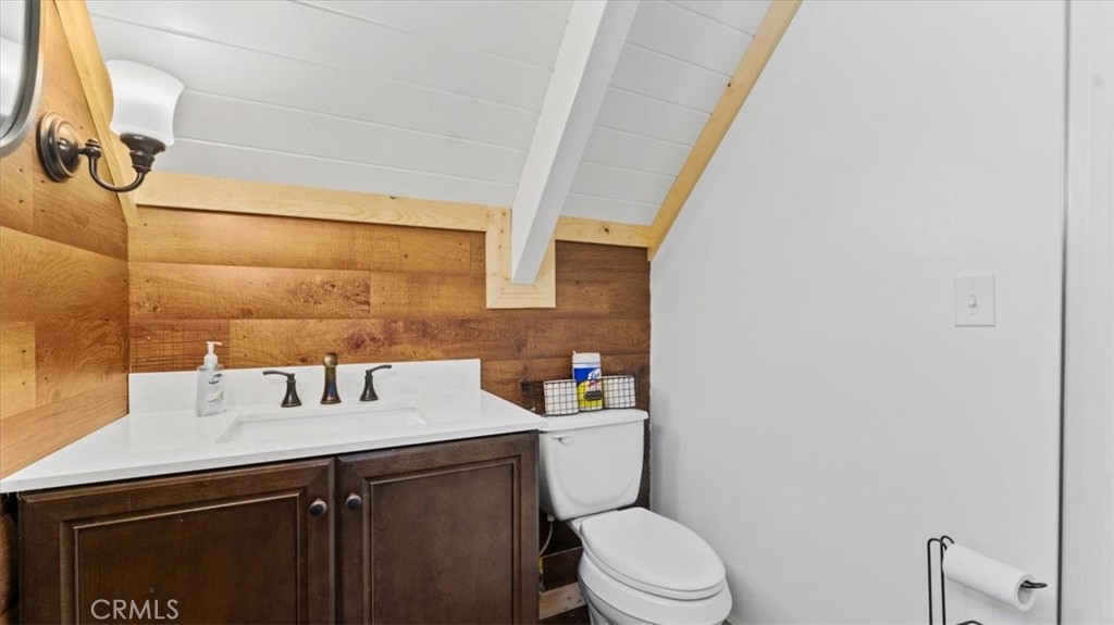 6231 Merry Way Clipper Mills, CA 95930 - Photo 30 of 60 a bathroom with a sink mirror vanity and toilet