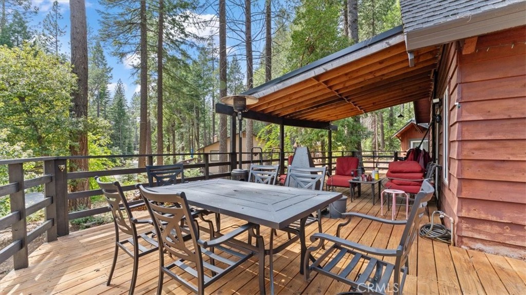 6231 Merry Way Clipper Mills, CA 95930 - Photo 37 of 60 a view of patio with table and chairs and wooden floor