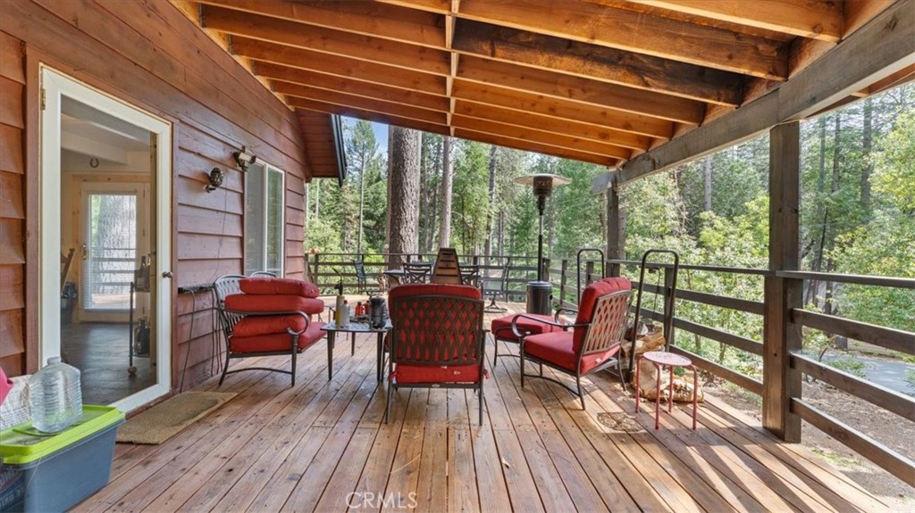 6231 Merry Way Clipper Mills, CA 95930 - Photo 5 of 60 a view of a chairs and table in patio with wooden floor