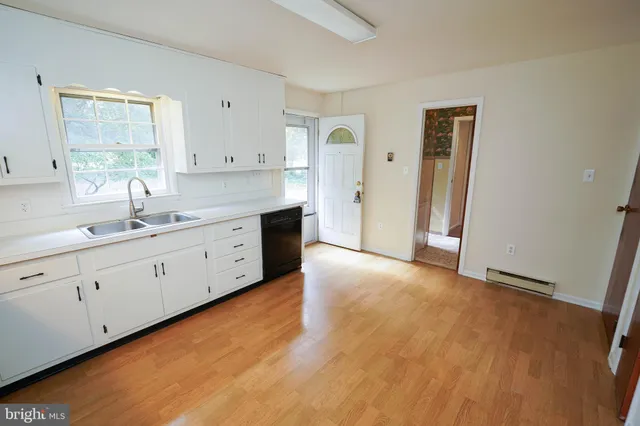 a view of livingroom with hardwood floor and window