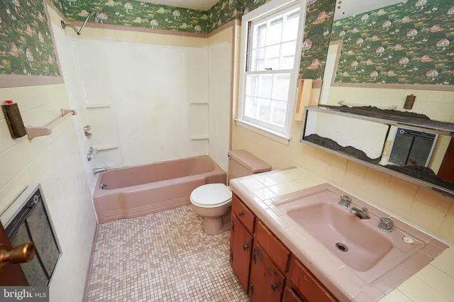 a bathroom with a tub and a shower