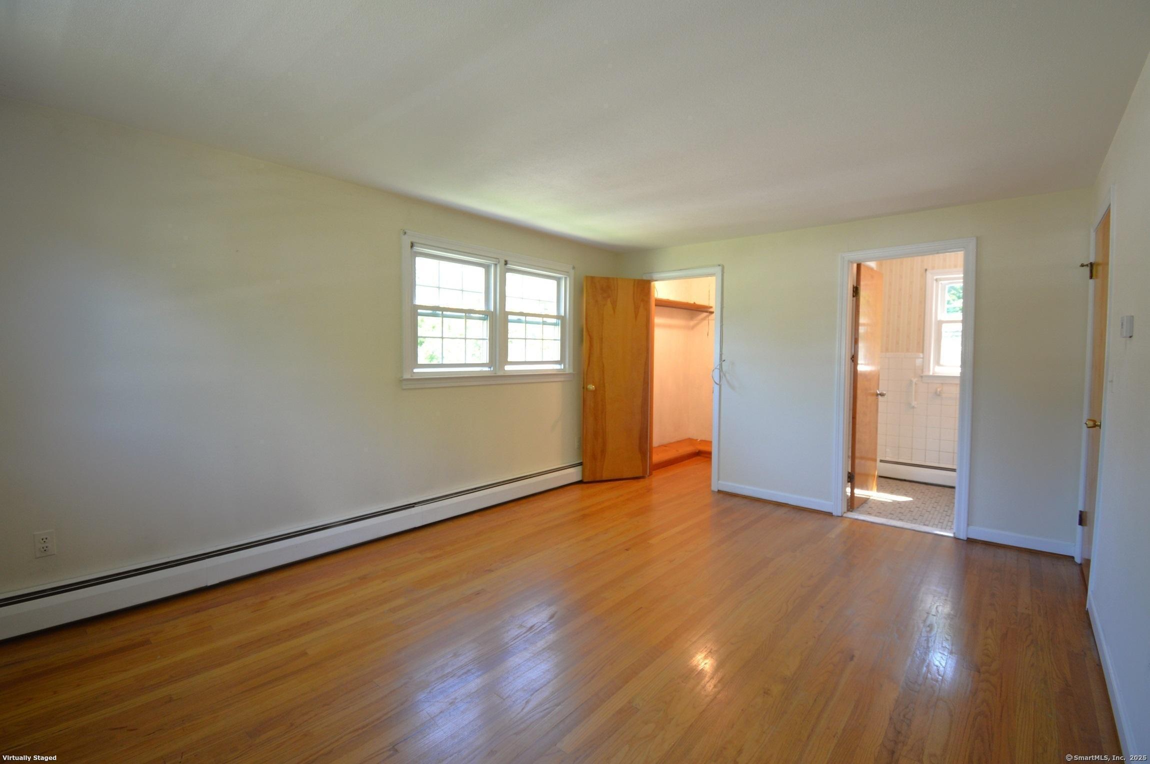 18 Overbrook Road West Hartford, CT 06107 - Photo 14 of 37 an empty room with wooden floor and windows