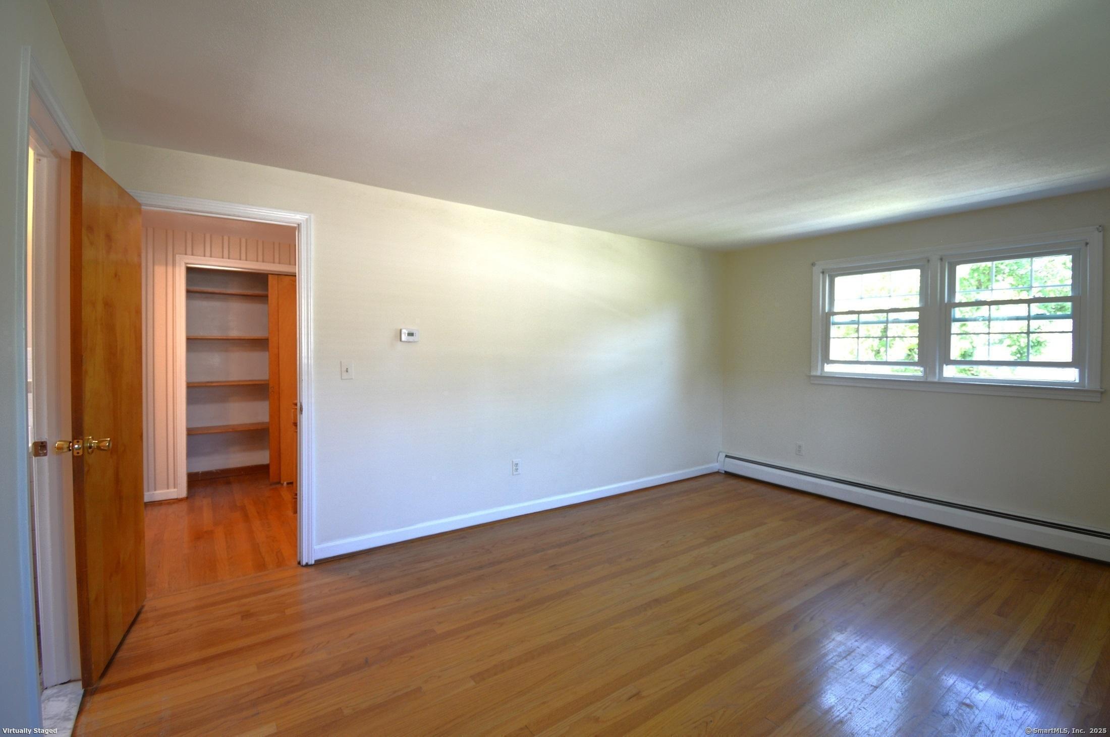 18 Overbrook Road West Hartford, CT 06107 - Photo 17 of 37 an empty room with wooden floor and windows