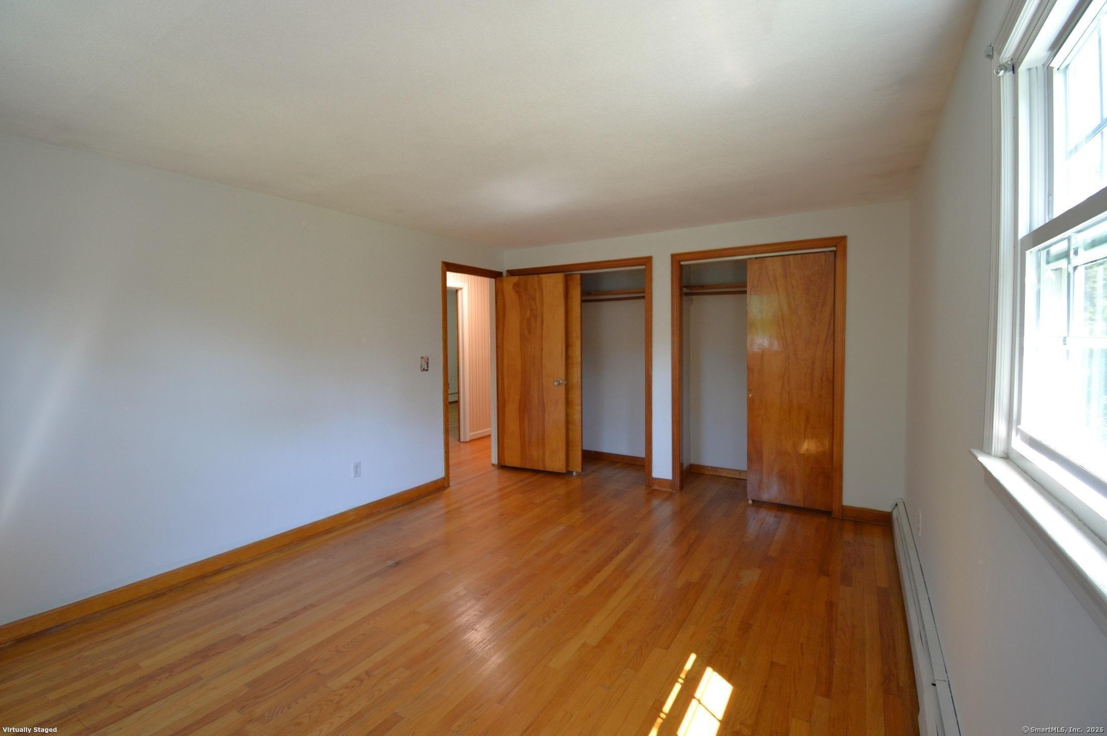 18 Overbrook Road West Hartford, CT 06107 - Photo 20 of 37 an empty room with wooden floor and windows