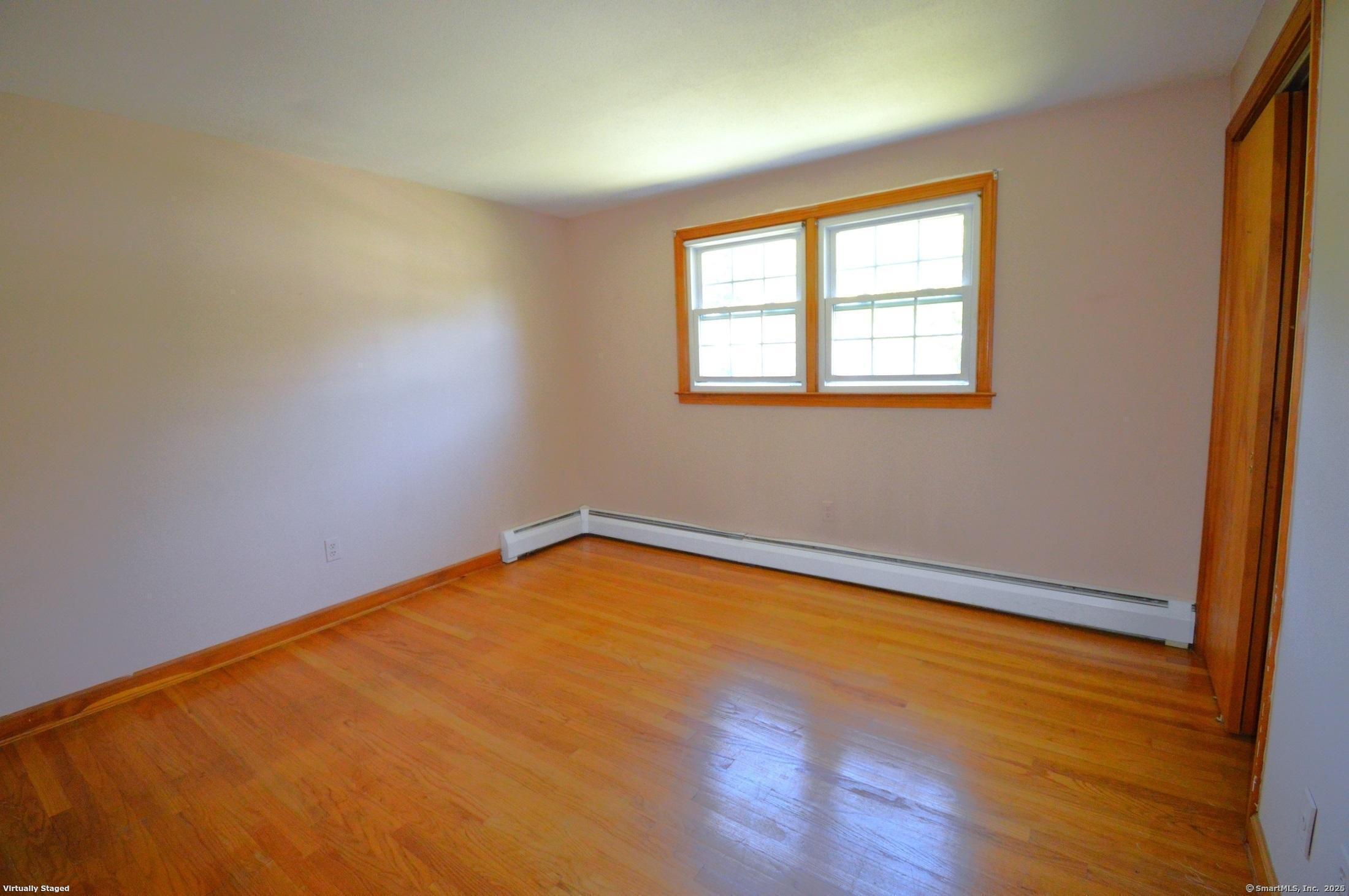 18 Overbrook Road West Hartford, CT 06107 - Photo 21 of 37 an empty room with wooden floor and windows