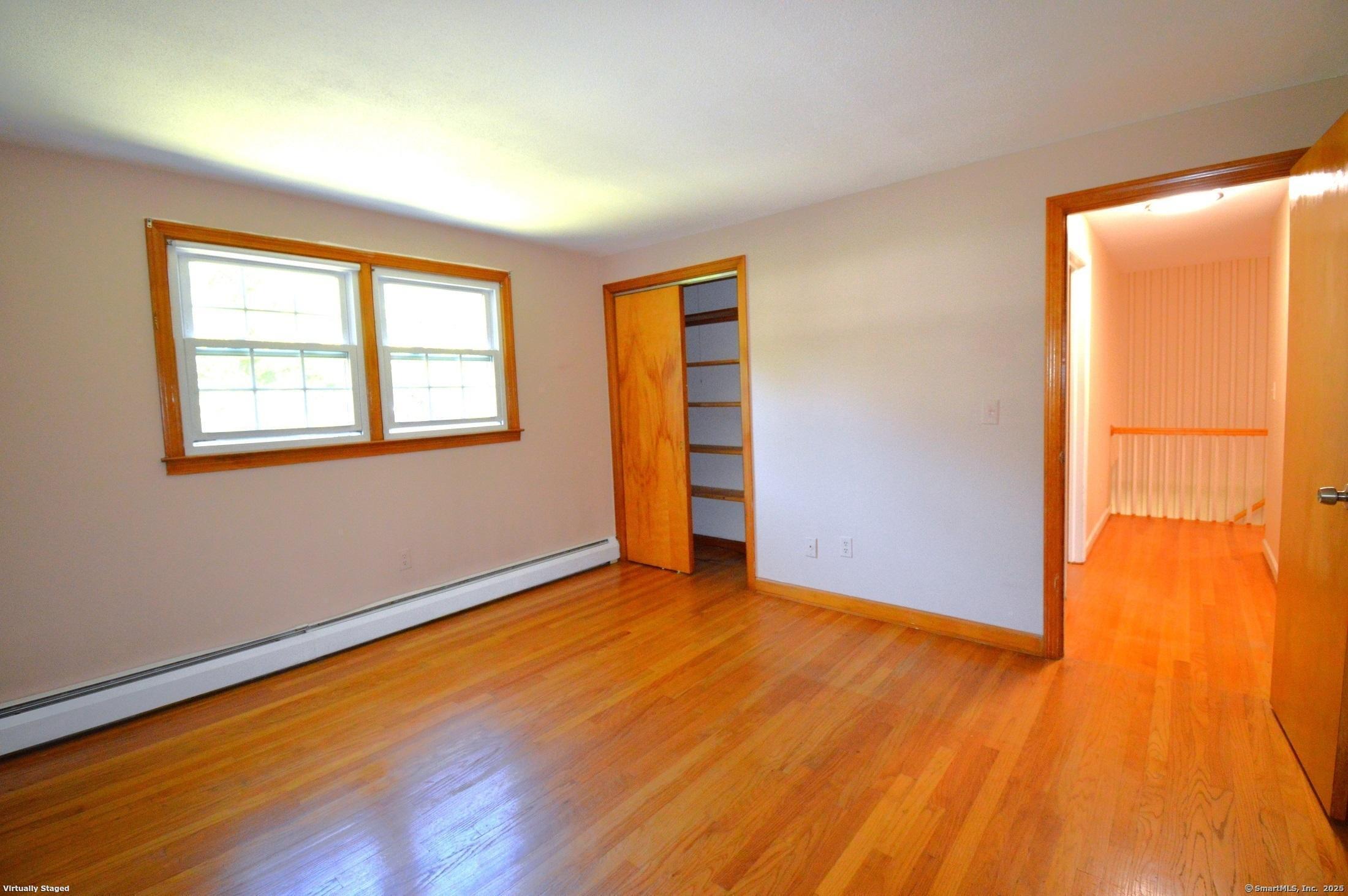 18 Overbrook Road West Hartford, CT 06107 - Photo 23 of 37 an empty room with wooden floor and windows