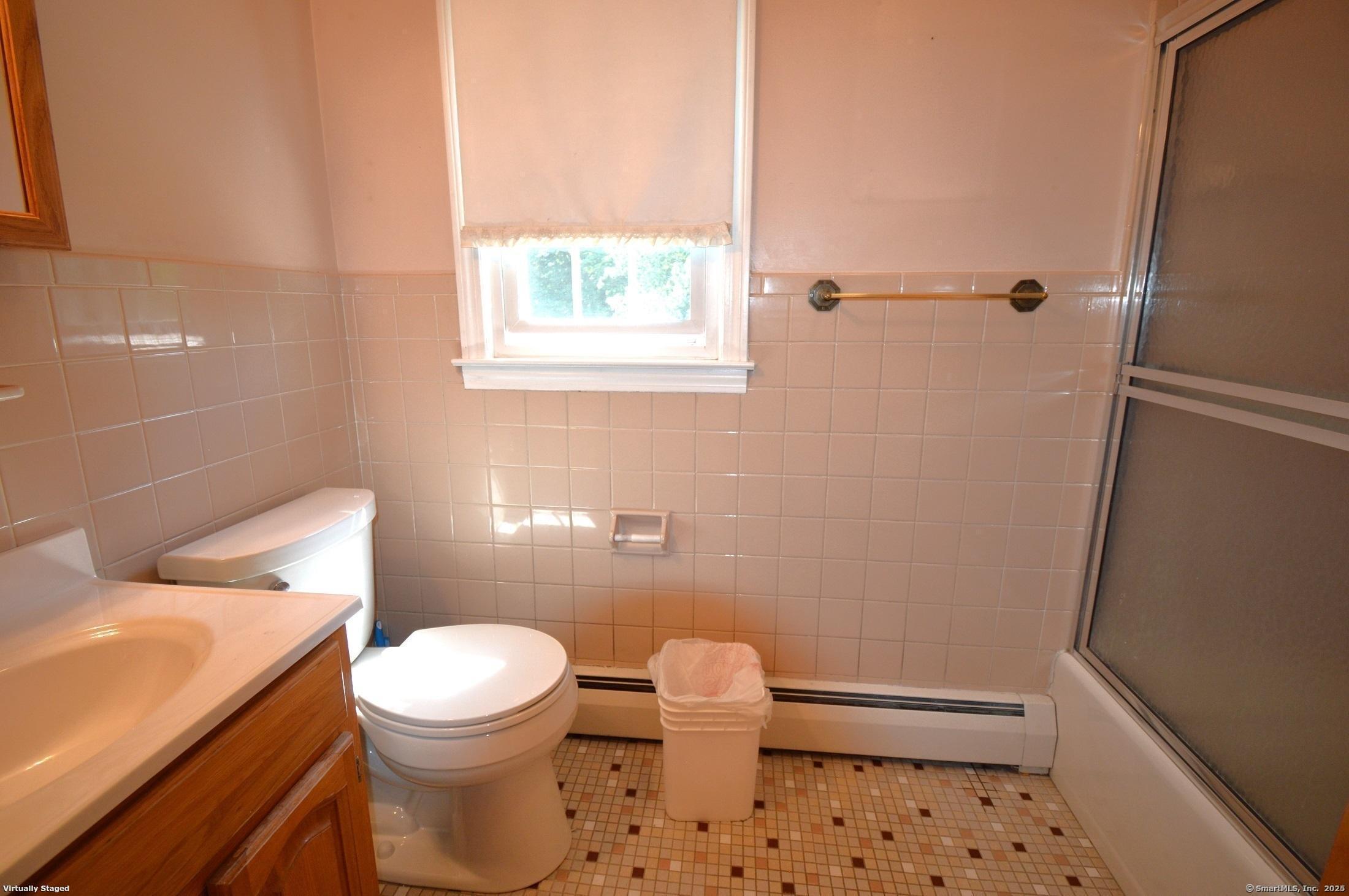 18 Overbrook Road West Hartford, CT 06107 - Photo 27 of 37 a white toilet sitting next to a bathroom sink and a tub