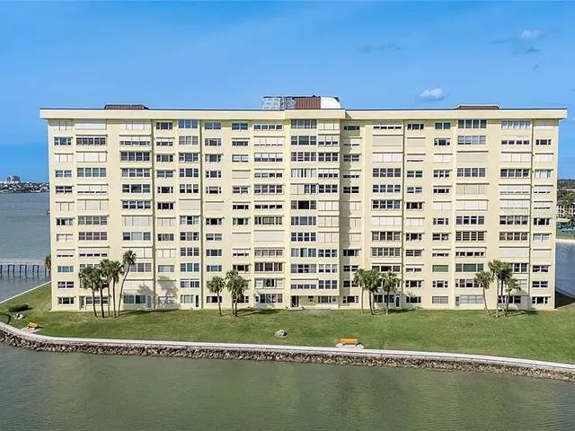 a view of a large building with a yard