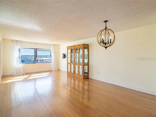 a kitchen with granite countertop stainless steel appliances and refrigerator