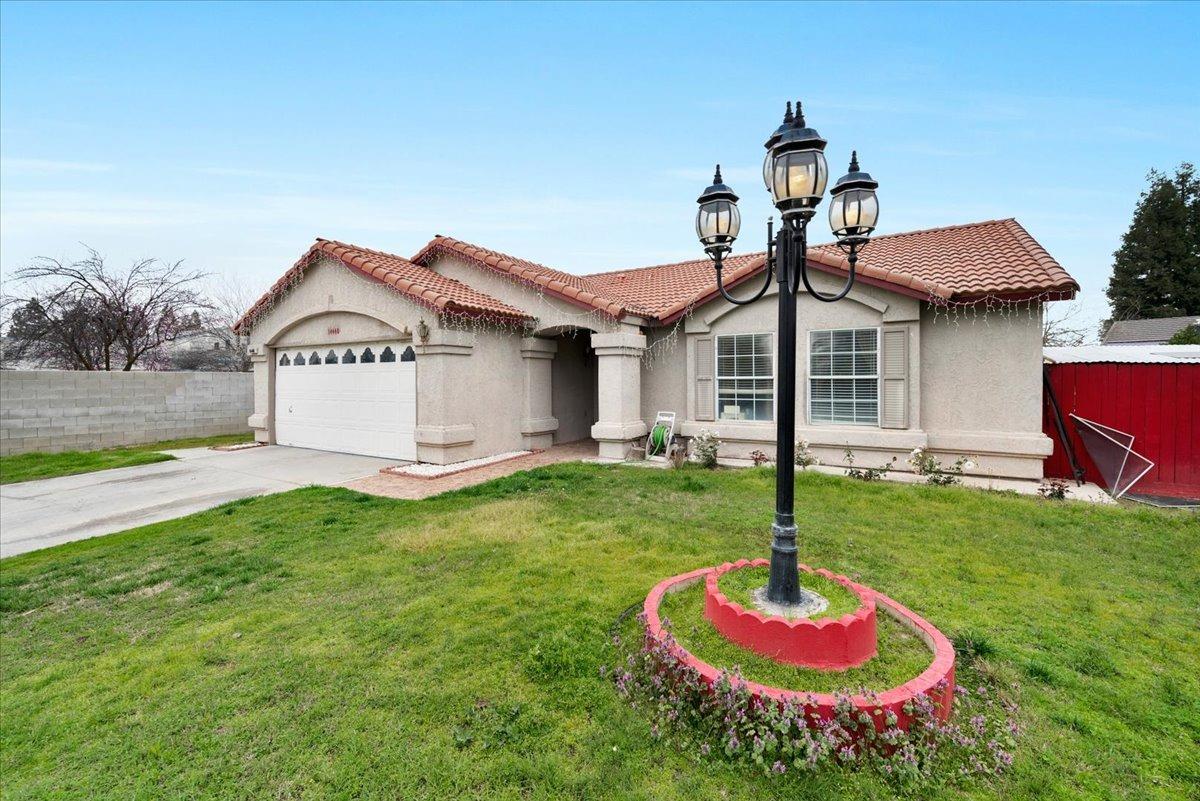 a front view of a house with garden