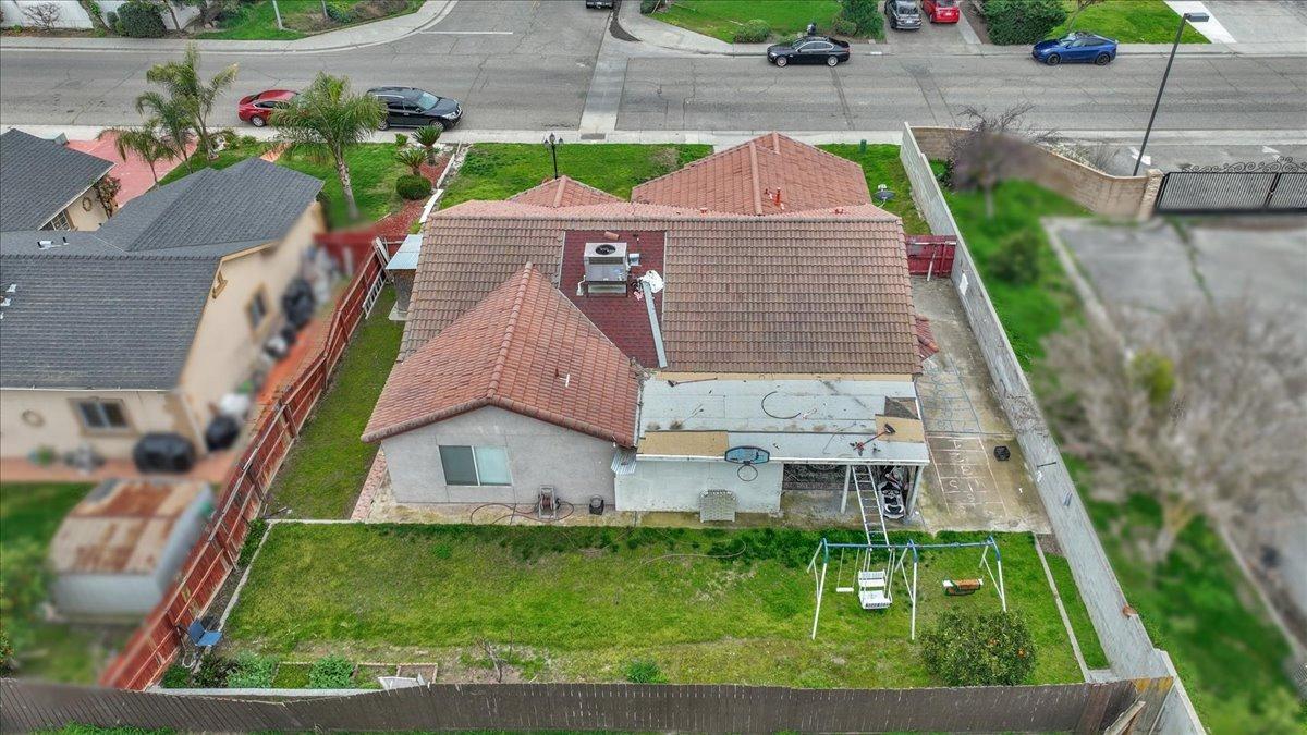 14440 West E Street Kerman, CA 93630 - Photo 11 of 13 a aerial view of a house with a yard