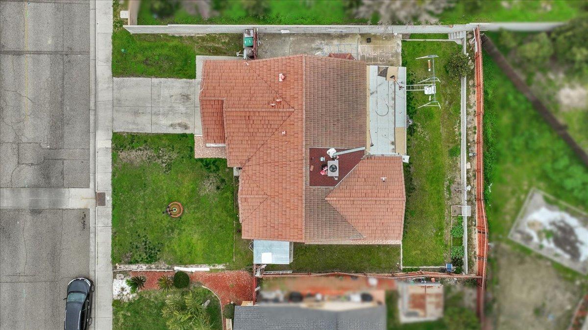 14440 West E Street Kerman, CA 93630 - Photo 13 of 13 an aerial view of a house with a yard