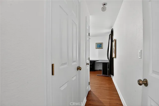 a bathroom with a toilet sink vanity tub and mirror