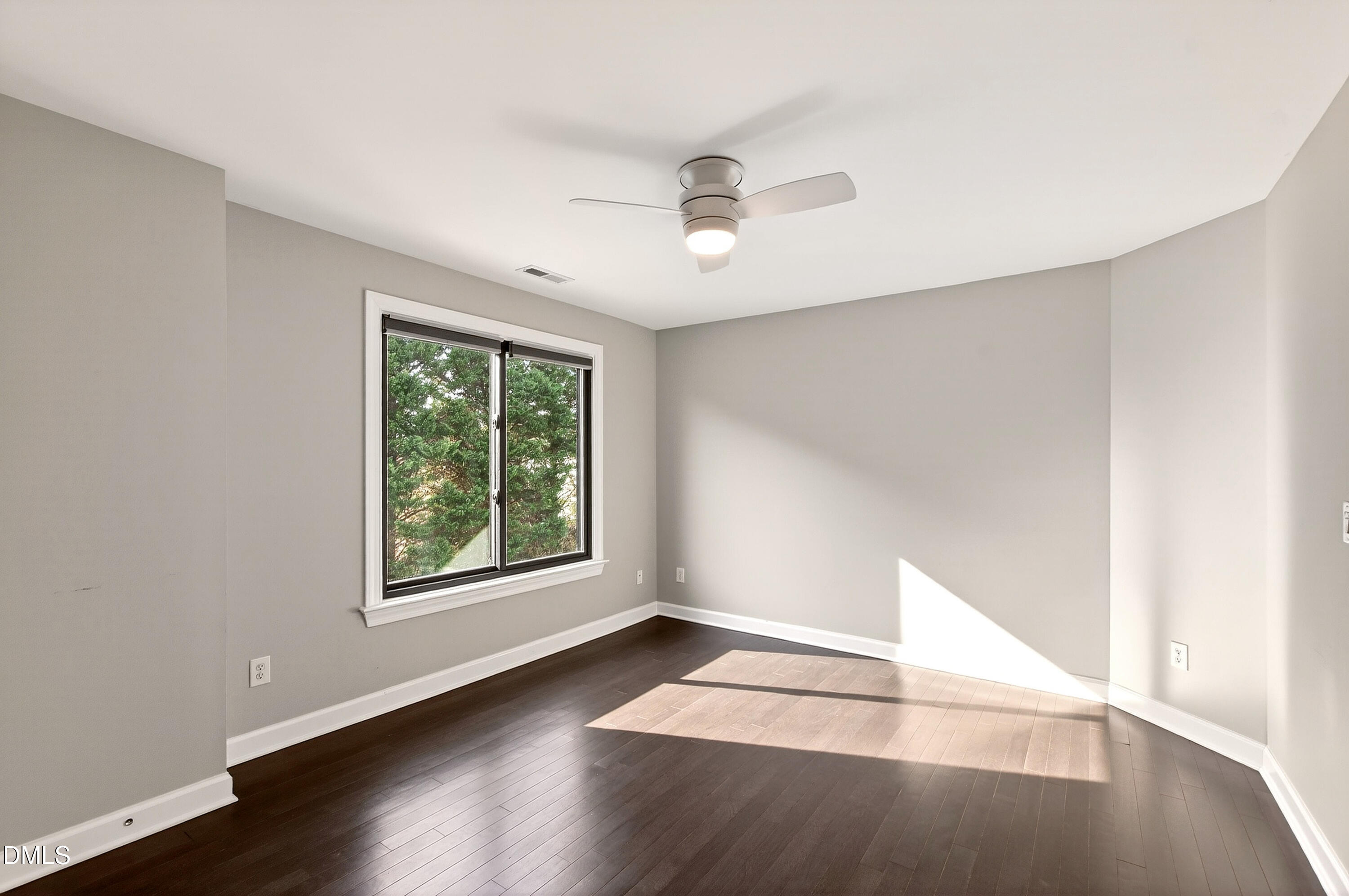 12408 Cilcain Court Raleigh, NC 27614 - Photo 33 of 80 an empty room with wooden floor and windows