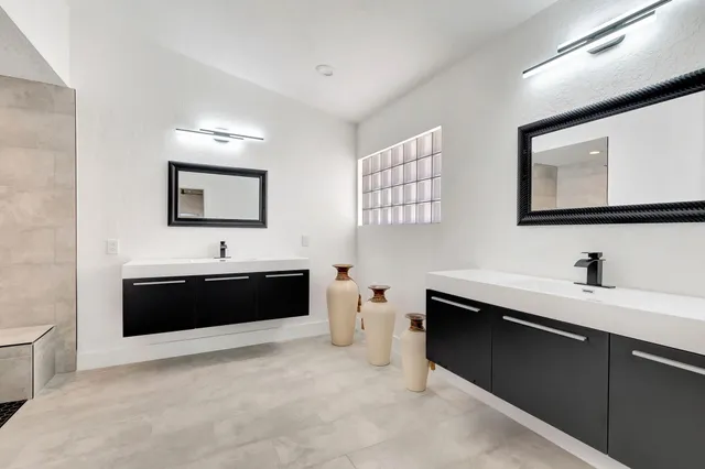 a bathroom with a sink a toilet and bathtub
