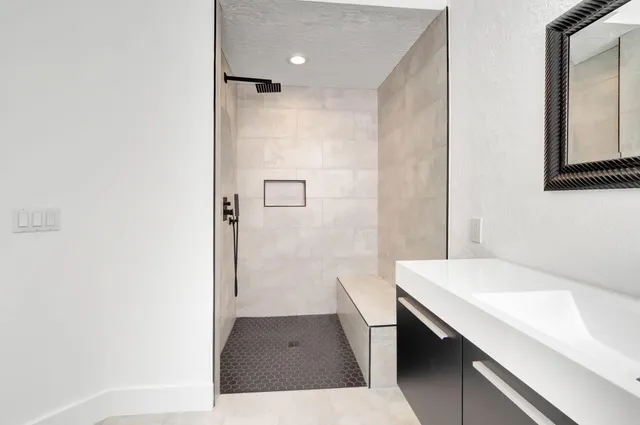 a bedroom with a large bed and a large window