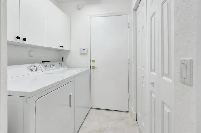 a outdoor living room with furniture and a potted plant