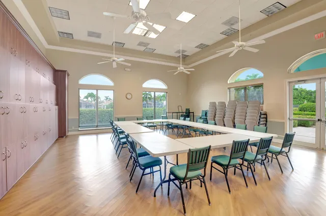 a view of a lake with a bench and trees