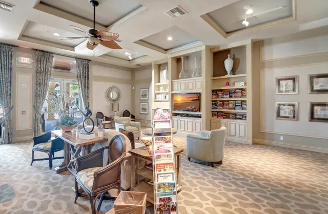 a room with lots of furniture and a large window