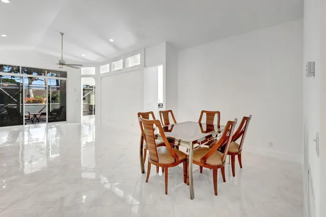 a kitchen with granite countertop white cabinets stainless steel appliances and sink