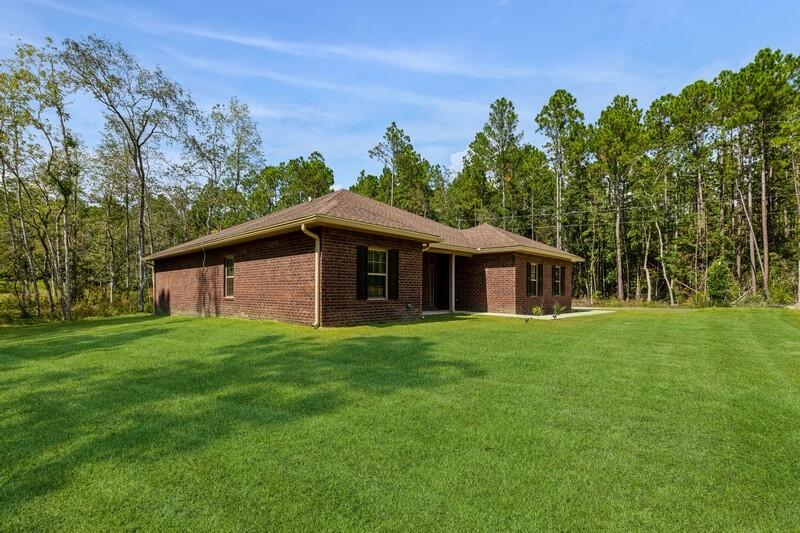 7656 4 Flags Road Laurel Hill, FL 32567 - Photo 3 of 52 FRONT OF HOME
