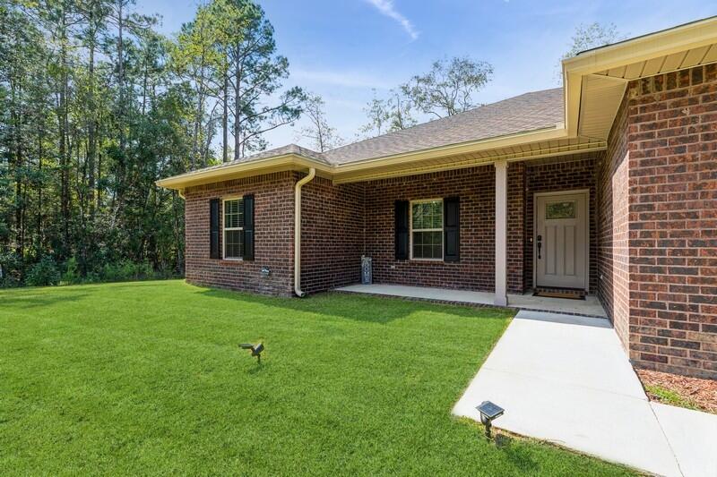 7656 4 Flags Road Laurel Hill, FL 32567 - Photo 5 of 52 FRONT OF HOME