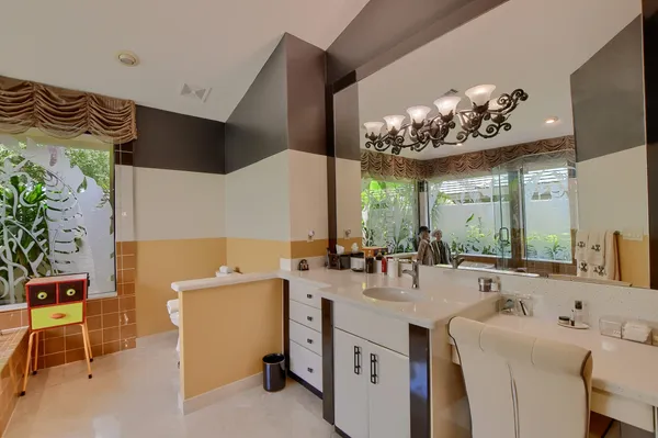 a bathroom with a double vanity sink a mirror and a shower
