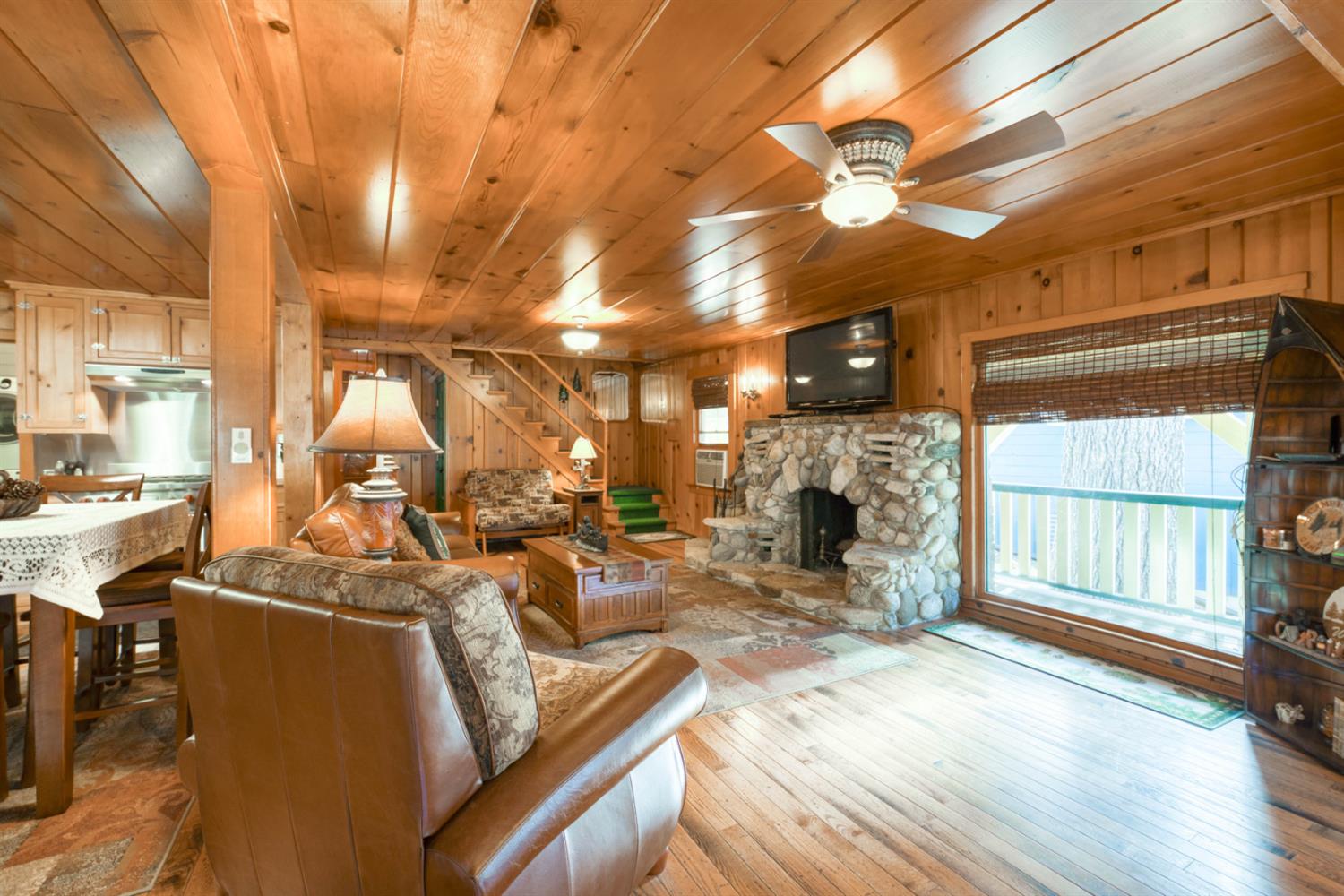 42025 Tollhouse Road Shaver Lake, CA 93664 - Photo 32 of 64 a living room with fireplace furniture and a large window