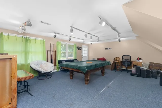 a room with furniture and a wooden floor