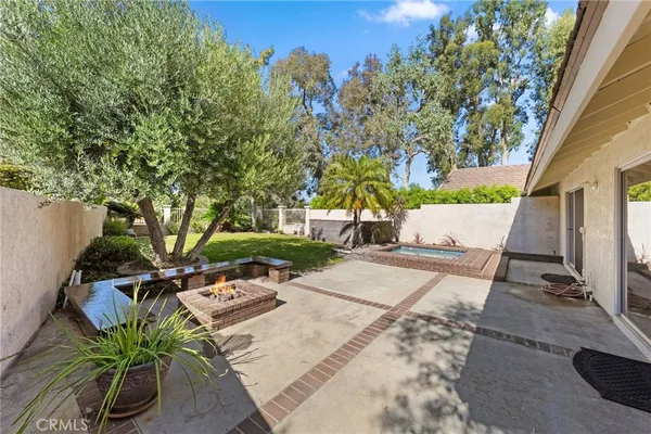 a view of a house with a yard porch and sitting area