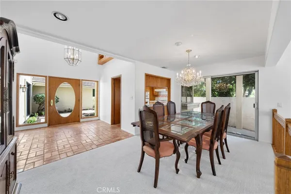 a bathroom with a granite countertop sink a toilet and a mirror