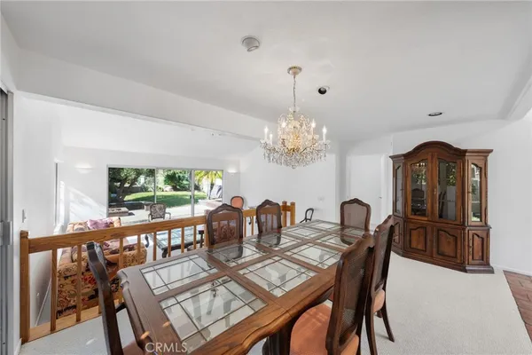 an empty room with a window and a ceiling fan