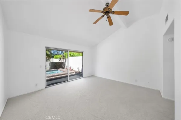 a view of a swimming pool with a yard