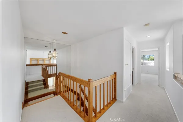 a view of a swimming pool with a yard and mountain view in the back