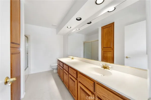 an aerial view of a house with a yard and garden