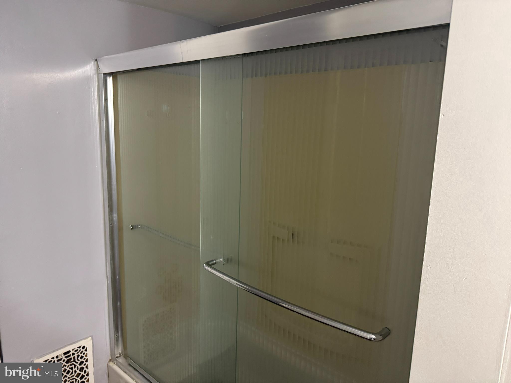 279-281 Arch Street Palmyra, NJ 08065 - Photo 15 of 29 a bathroom with a glass shower door