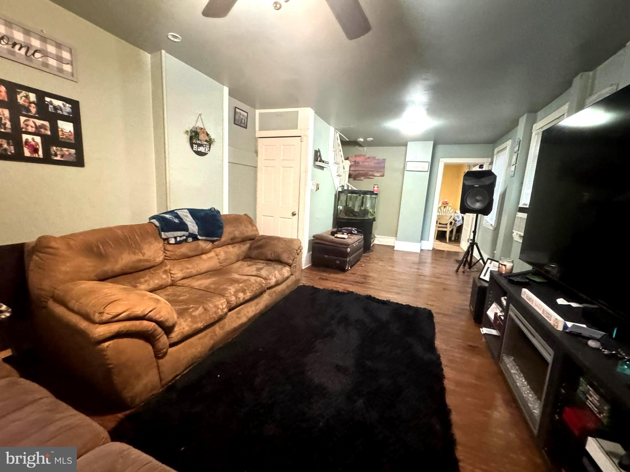 279-281 Arch Street Palmyra, NJ 08065 - Photo 16 of 29 a living room with furniture and a flat screen tv